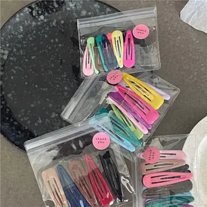 Pastel macaron color teardrop metal hair clips in transparent bags with thank you stickers