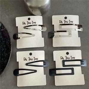 Matte black and silver metallic hair clips set in rectangle and teardrop shapes