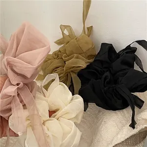 Set of mesh oversized bow scrunchies in pink, cream white, olive green, and black colors