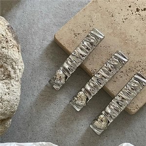 Minimalist silver wavy textured metal hair clips set with heart relief decoration