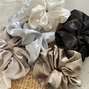 Set of silky satin hair scrunchies in minimalist neutral colors and pleated design