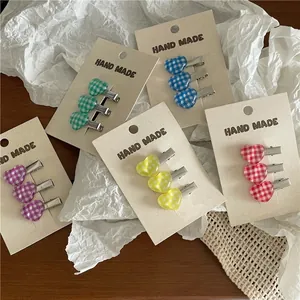 Cute colorful checkered heart hair clips set in purple, green, blue, yellow, and red