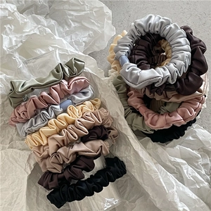 Silk satin scrunchies set in various elegant colors for ponytails and hair styling