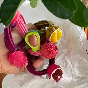 Cute fruit hair ties set featuring avocado, dragon fruit, and durian with colorful elastics