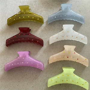 Set di 7 mollette per capelli in plastica colorata con strass in tonalità trasparenti