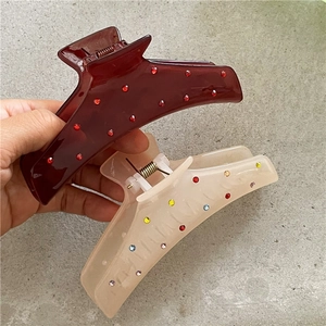 Set di due mollette per capelli con strass colorati in bordeaux e bianco crema