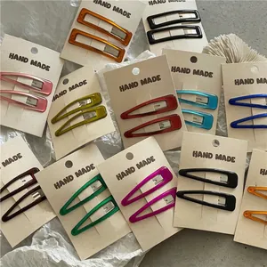 Colorful resin rectangle and water drop hair clips set on display cards for women