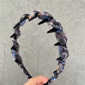 Close-up of vintage dark purple floral headband with non-slip teeth and built-in hair clips