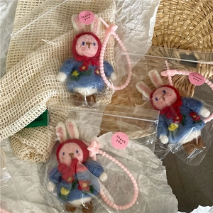 Handmade wool felt bunny keychain with red hood and floral dress in gift packaging