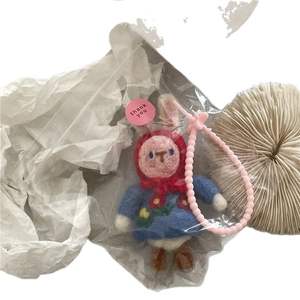 Handmade wool felt rabbit charm with red hood and floral dress on pink bead strap