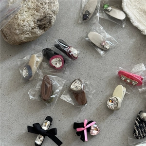 Detail of Korean style hair clips with rhinestones and ribbon bows for girls