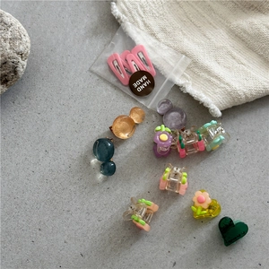 Colorful resin flower and heart hair clips set for girls in various vibrant pastel colors