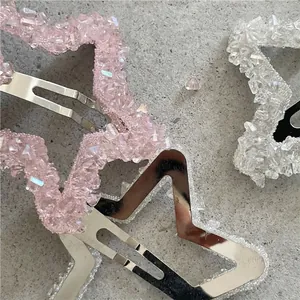 Fermagli BB a stella con cristalli rosa e bianchi su metallo argentato lucido