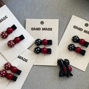 Cute polka dot hair clip set with round beads and handmade fabric base for girls
