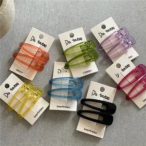 Detailed view of colorful translucent resin teardrop hair clips in a multi-color set
