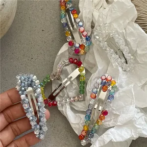 Detail of luxury teardrop and heart crystal beaded hair clips with elegant finish