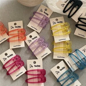 Colorful translucent resin teardrop hair clips set on display cards for girls