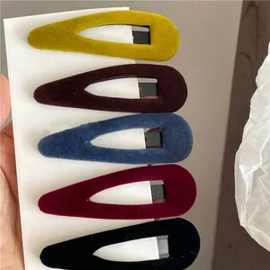 Set of five velvet waterdrop hair clips in yellow, navy, burgundy, black, and brown