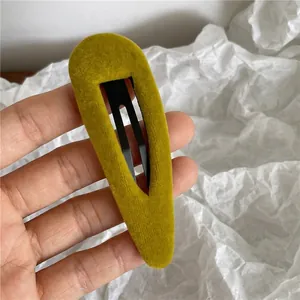 Yellow velvet drop-shaped BB hair clip with elegant flocking texture on metal base