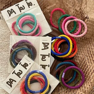 Macaron color high elastic hair ties set with ripple knit texture on natural background