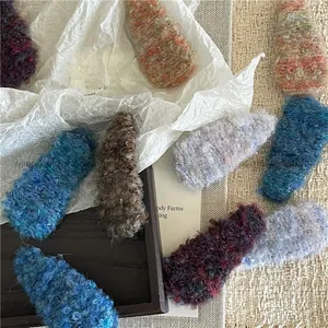 Close-up of colorful plush teardrop BB hair clips with soft fuzzy texture