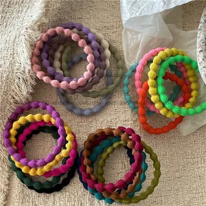 Detailed view of colorful bubble textured hair ties in assorted soft pastel colors