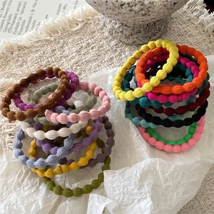 Set of colorful bubble texture elastic hair ties in vibrant pastel and neutral shades