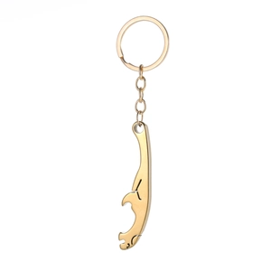 Detailed close-up of a golden leopard-shaped stainless steel keychain on white background
