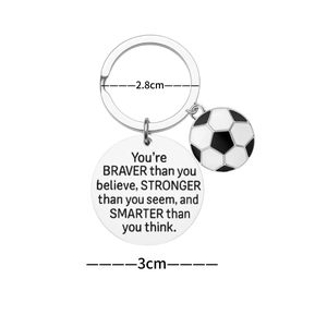 Stainless steel soccer keychain with black and white ball charm and inspirational quote