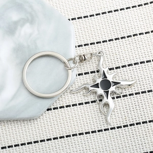 Gothic flame cross keychain in silver alloy with black enamel center and metal hook