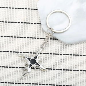 Gothic flame cross keychain in silver metal with black center detail and lobster clasp