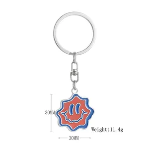 Detail of wavy smiley keychain with dimensions 30mm and weight 11.4g highlighted