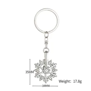 Rotating silver snowflake keychain with sparkling rhinestones, measures 35mm by 34mm size