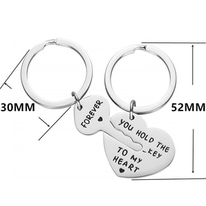 Polished stainless steel couple keychain set with You Hold The Key To My Heart engraving