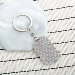 Hip hop style silver metal keychain featuring eagle tag and honeycomb textured pendant