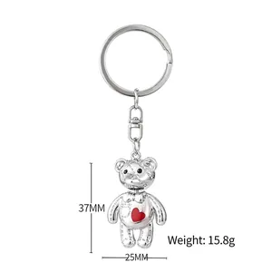 Silver bear keychain with red heart detail and dimensions 37mm by 25mm on white background