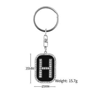 Hip hop style crystal encrusted letter H keychain with black enamel finish for backpacks