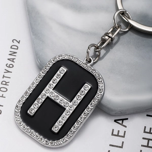 Hip hop silver keychain with black enamel square pendant and iced out letter H charm
