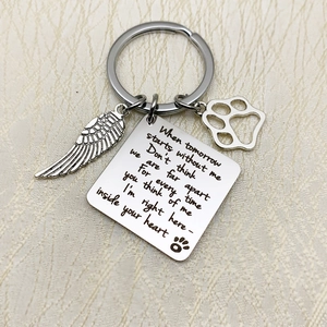 Silver stainless steel pet memorial keychain with feather wing and paw print charms