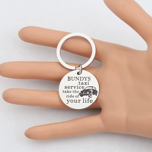 Stainless steel Bundys Taxi Service keychain with engraved beetle car and slogan