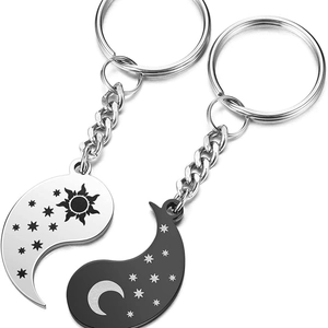 Matching sun and moon couple keychain set in polished stainless steel yin yang design