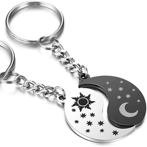 Matching sun and moon puzzle couple keychains in silver and black stainless steel