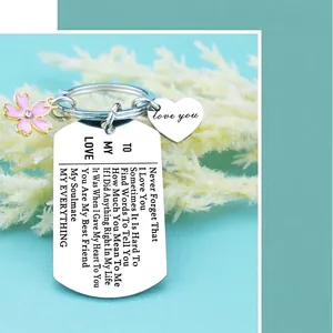 To My Love keychain with pink cherry blossom and heart charms on a blue background