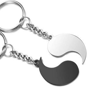 Matching sun and moon puzzle couple keychains in silver and black stainless steel