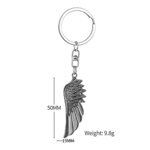 Retro angel wing keychain in antique silver finish with detailed feather texture