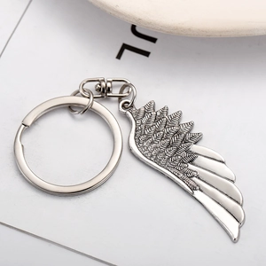 Vintage silver metal wing keychain with detailed feather texture and sturdy swivel clasp
