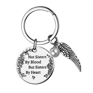 Stainless steel friendship keychain with pearl and wings, engraved with sisters message
