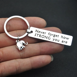 Elephant charm keychain with engraved 'Never forget how STRONG you are' metal plate