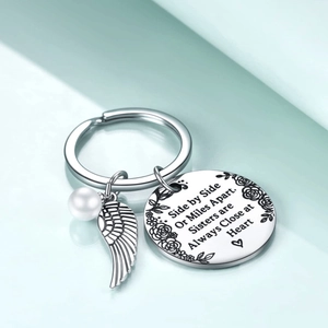 Stainless steel sister keychain with angel wing, pearl, and engraved friendship quote
