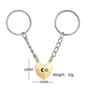 Magnetic sun and moon couple heart keychains in gold and silver finish on white background